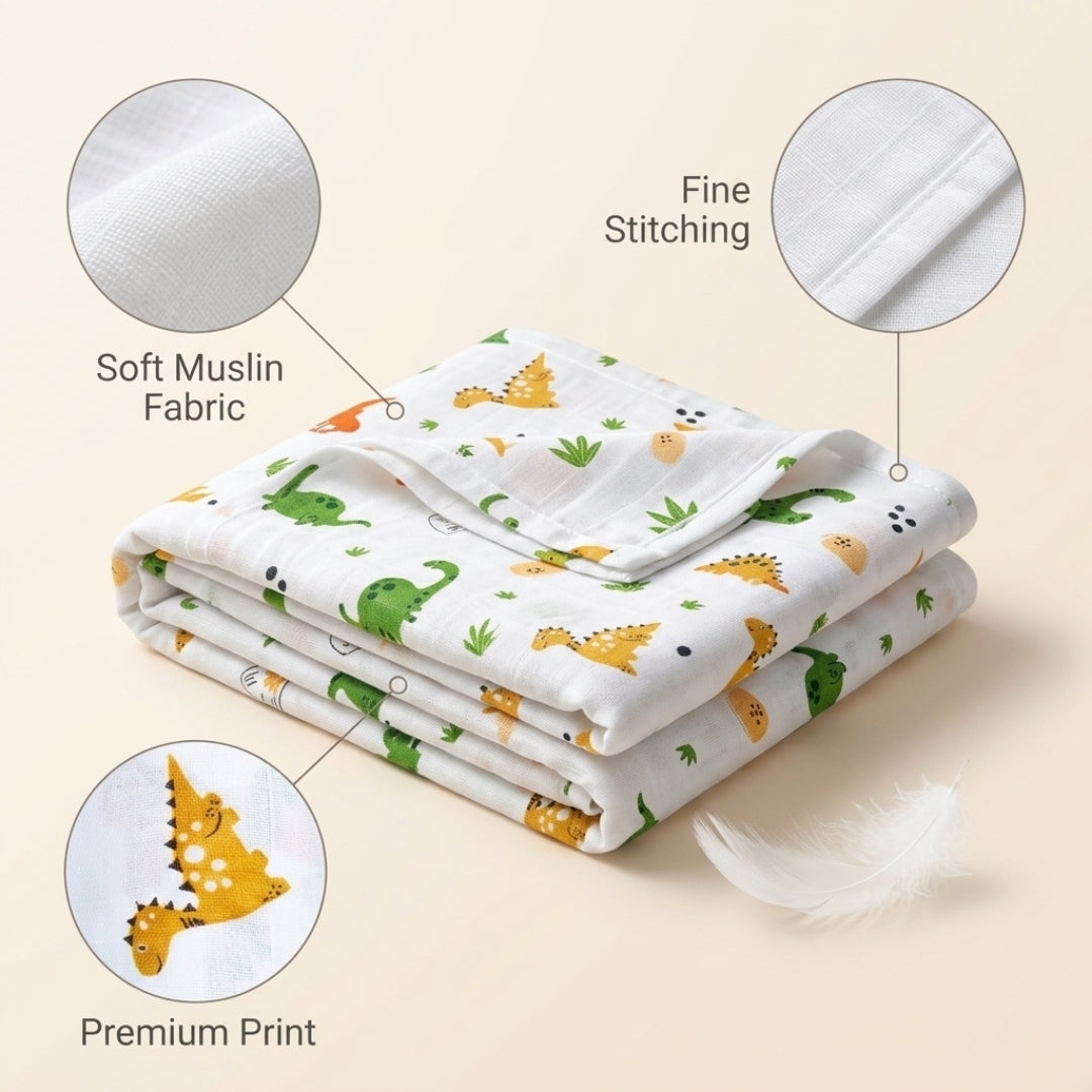 Folded baby blanket with dinosaur pattern on a beige background, showing soft muslin fabric, fine stitching, and premium print details.