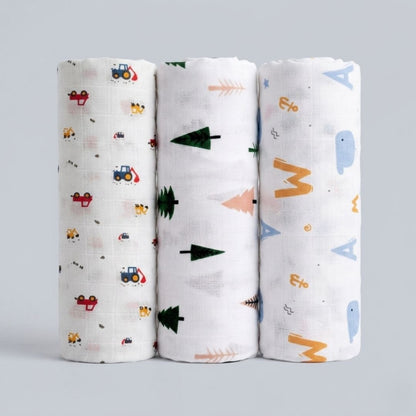 LazyToddler muslin swaddle blankets set of 3 in Crane, Tree and Alphabets prints laid flat