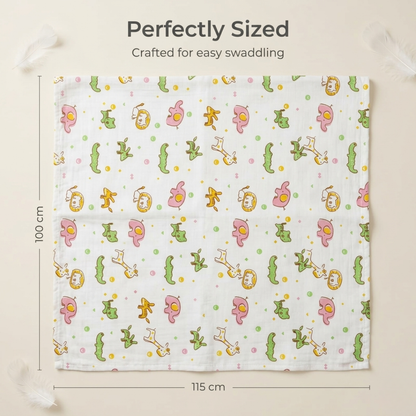 Folded stack of three muslin swaddle blankets in Giraffe, Elephant and Blue Dino designs