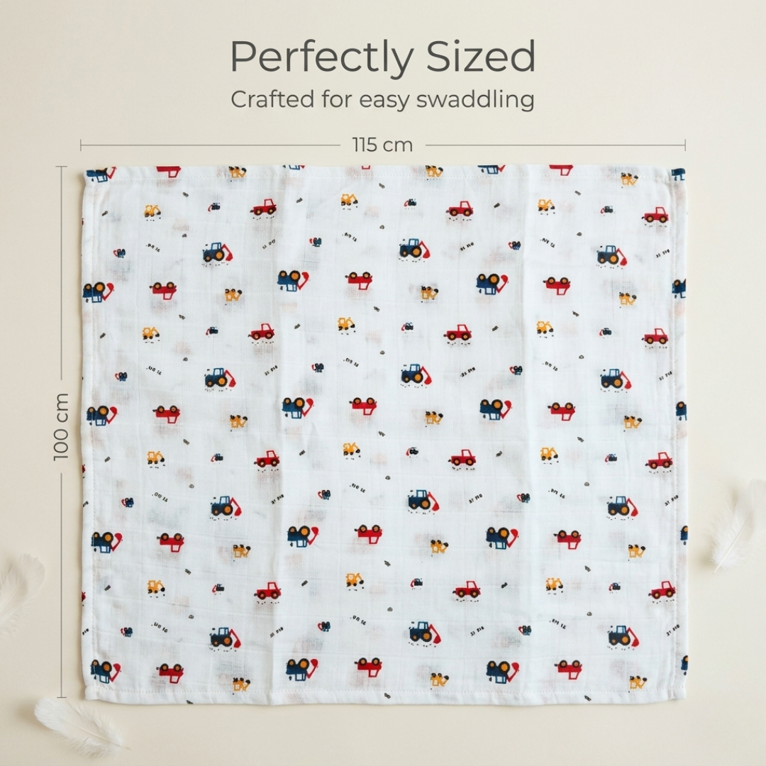 Newborn wrapped in soft Crane print muslin swaddle blanket by LazyToddler