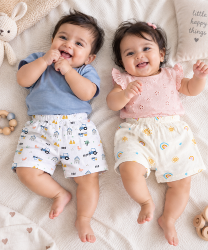 Cute babies - boy and girl - wearing LazyToddler muslin cotton shorts in printed designs