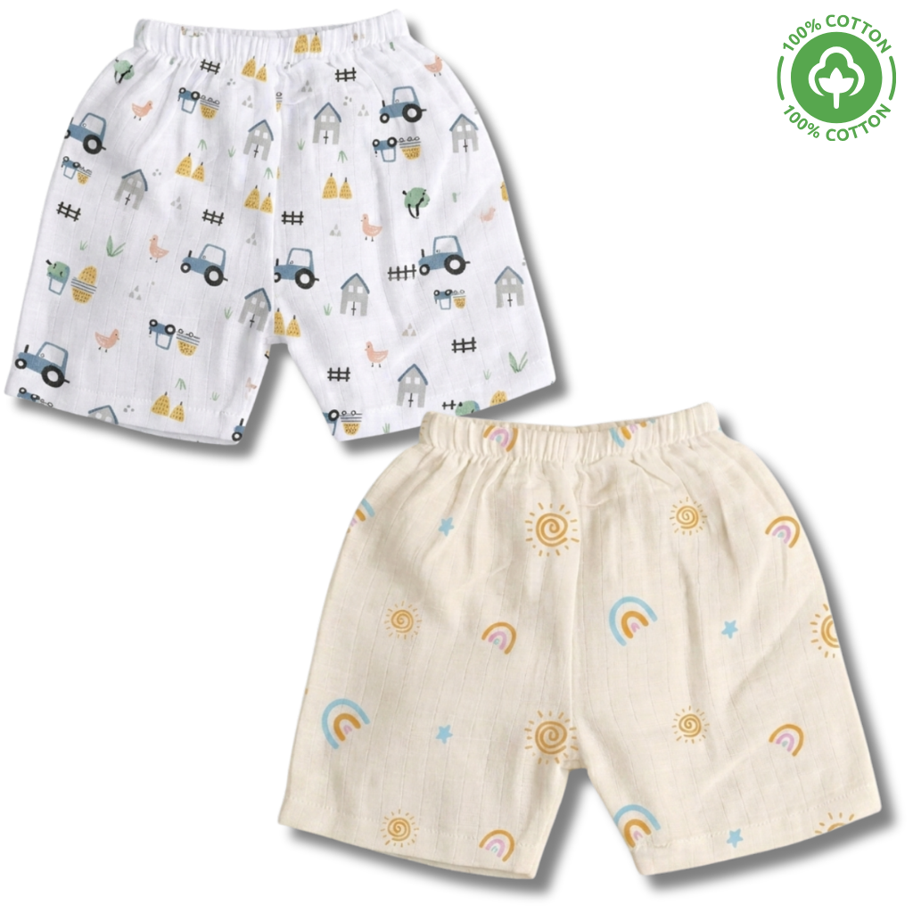 LazyToddler muslin baby shorts front view featuring the Farmhouse print with rustic farmhouse motifs and the Sun print with cheerful sunshine motifs.