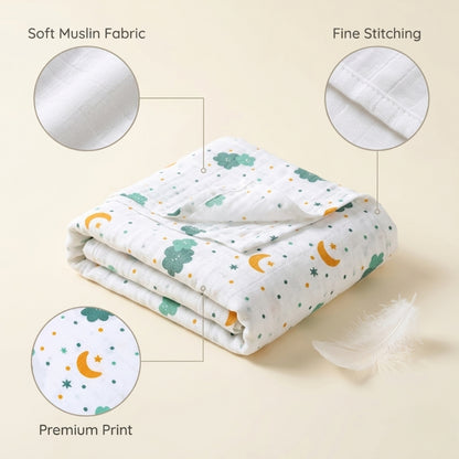 Folded blanket with illustrations on a beige background, labeled for soft muslin fabric, fine stitching, and premium print.