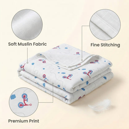 Newborn baby wrapped in soft organic muslin swaddle blanket with cycle