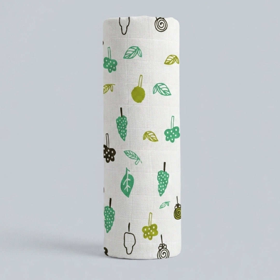 swaddle roll with green and brown pattern on a light gray background