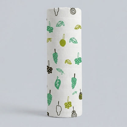 swaddle roll with green and brown pattern on a light gray background