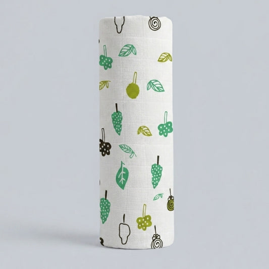 swaddle roll with green and brown pattern on a light gray background