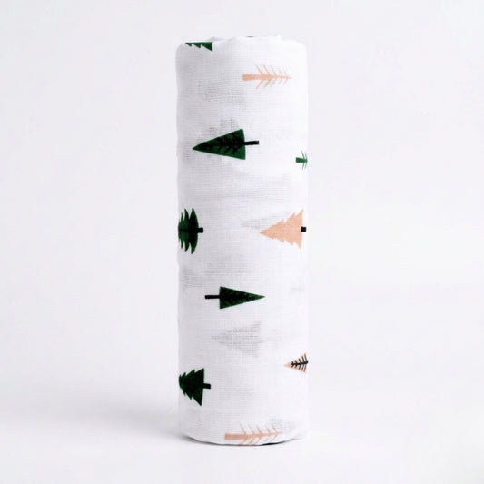 White swaddle blanket with green and pink arrow patterns on a white background